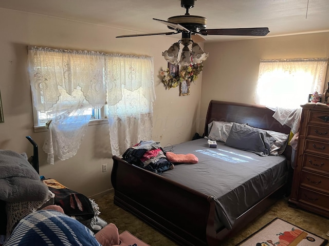 bedroom featuring ceiling fan and carpet floors