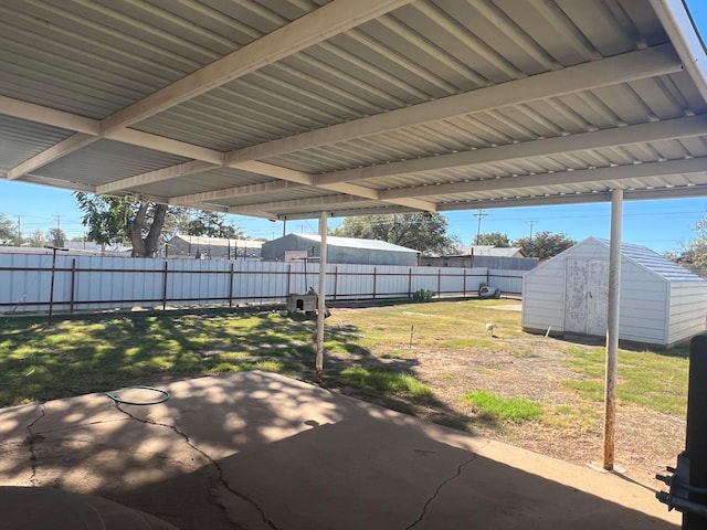 view of patio / terrace featuring a storage unit