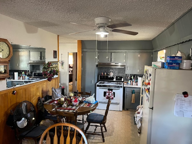 kitchen featuring gray cabinets, a textured ceiling, white appliances, and ceiling fan