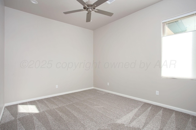 empty room featuring carpet, a ceiling fan, and baseboards
