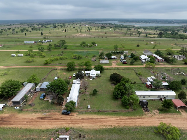 birds eye view of property with a rural view