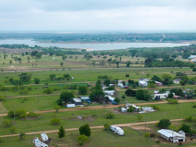 birds eye view of property with a water view and a rural view