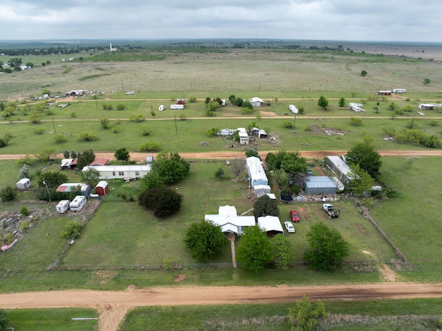 birds eye view of property with a rural view