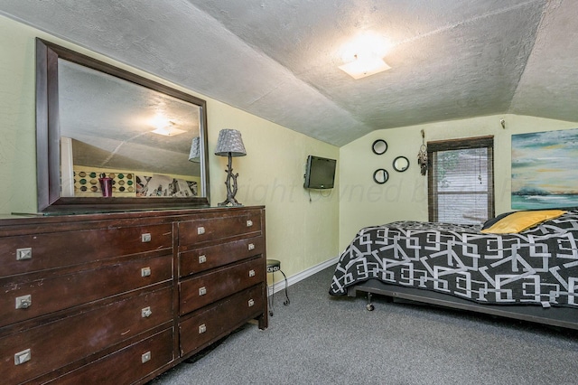131 S Nelson St, Pampa, TX 79065 - bedroom with lofted ceiling, carpet, a textured ceiling, and baseboards