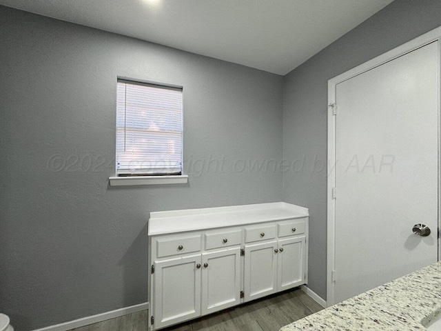 unfurnished bedroom featuring dark hardwood / wood-style flooring