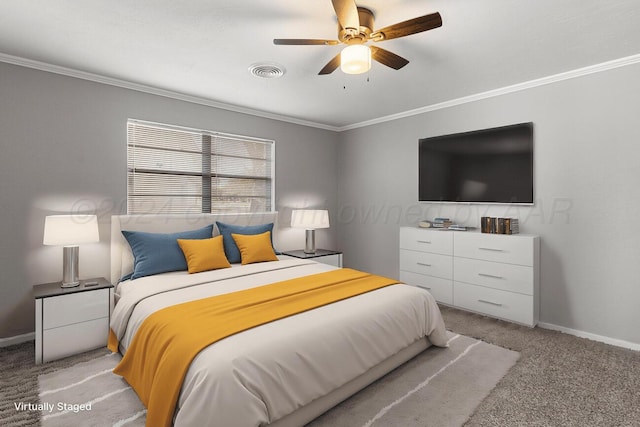 carpeted bedroom with ceiling fan and crown molding