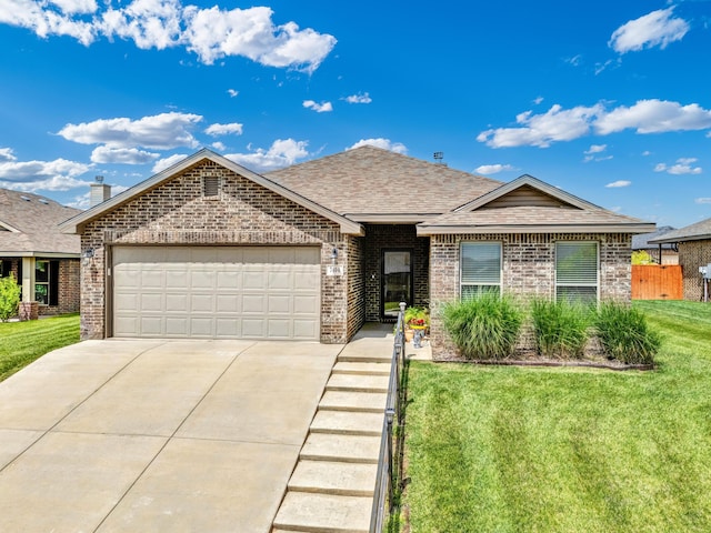 7404 Sinclair St, Amarillo, TX 79119 - single story home with brick siding, a garage, a shingled roof, and driveway