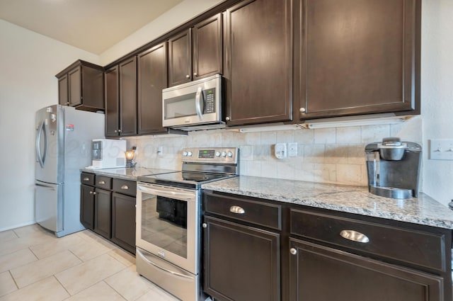 7404 Sinclair St, Amarillo, TX 79119 - kitchen featuring stainless steel appliances, dark brown cabinets, and light stone countertops
