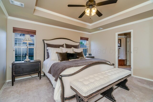 3507 Spokane Ave, Amarillo, TX 79118 - bedroom with light carpet, a raised ceiling, ornamental molding, ceiling fan, and ensuite bath