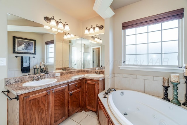 3507 Spokane Ave, Amarillo, TX 79118 - full bathroom with a tub with jets, double vanity, and tile patterned flooring