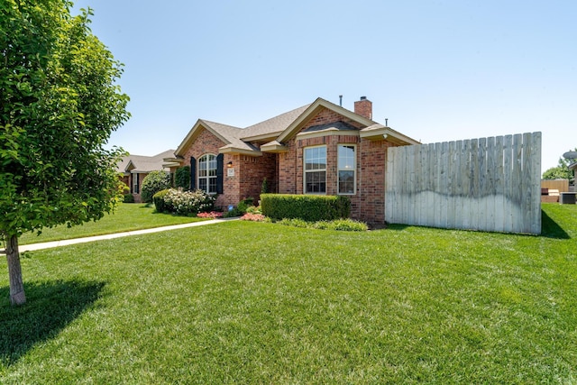 3507 Spokane Ave, Amarillo, TX 79118 - view of front of house featuring a chimney, brick siding, and a front lawn
