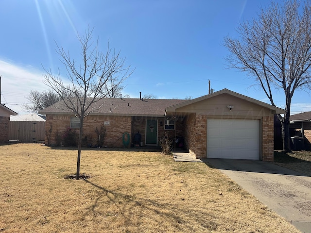 single story home with a garage and a front yard