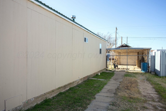 view of yard featuring an outbuilding and visible vents