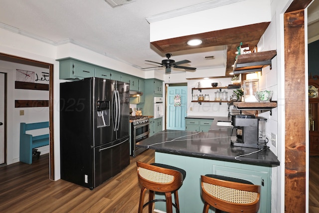 315 Walnut Ave, Panhandle, TX 79068 - kitchen with refrigerator with ice dispenser, green cabinetry, open shelves, a peninsula, and stainless steel gas stove
