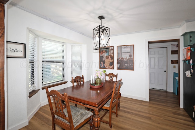 315 Walnut Ave, Panhandle, TX 79068 - dining area featuring a chandelier, crown molding, and wood finished floors