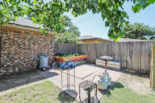 315 Walnut Ave, Panhandle, TX 79068 - fenced backyard featuring a patio area