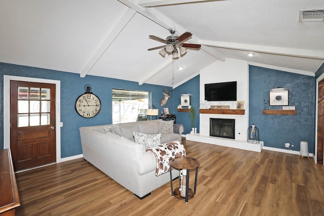 315 Walnut Ave, Panhandle, TX 79068 - living room featuring a ceiling fan, wood finished floors, and a fireplace