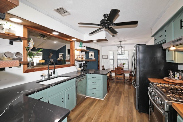 315 Walnut Ave, Panhandle, TX 79068 - kitchen featuring ceiling fan, open shelves, appliances with stainless steel finishes, dark wood-type flooring, and recessed lighting