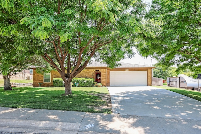 6728 Arroyo Dr, Amarillo, TX 79108 - view of property hidden behind natural elements featuring driveway and an attached garage