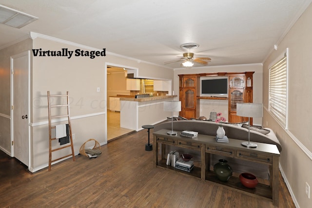 1307 Cooley Dr, Borger, TX 79007 - living area featuring ceiling fan, wood finished floors, ornamental molding, and baseboards
