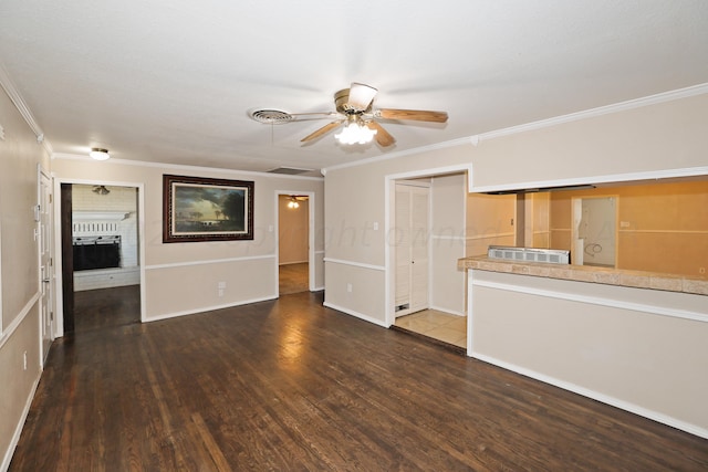 1307 Cooley Dr, Borger, TX 79007 - unfurnished living room featuring ceiling fan, ornamental molding, wood finished floors, and a fireplace
