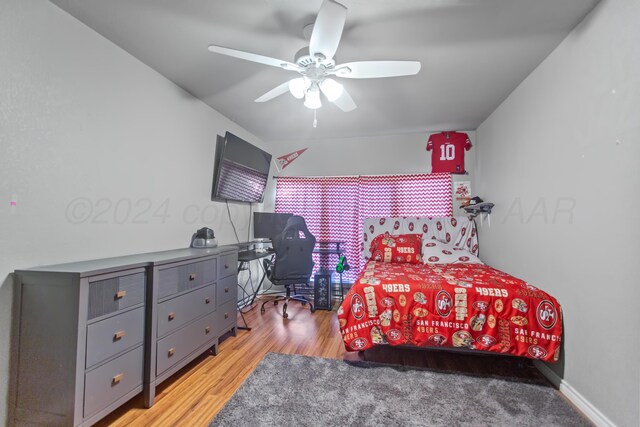 bedroom featuring ceiling fan and light hardwood / wood-style flooring