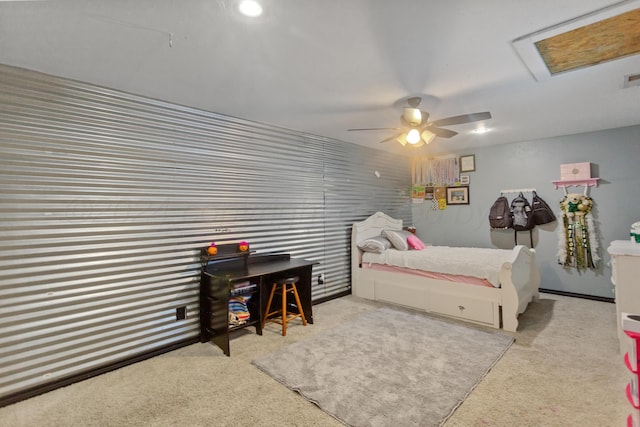 bedroom featuring a skylight, light carpet, and ceiling fan