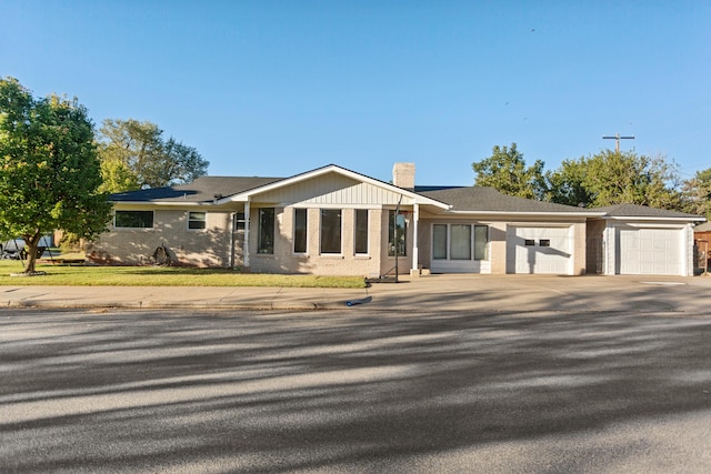 ranch-style house featuring a garage