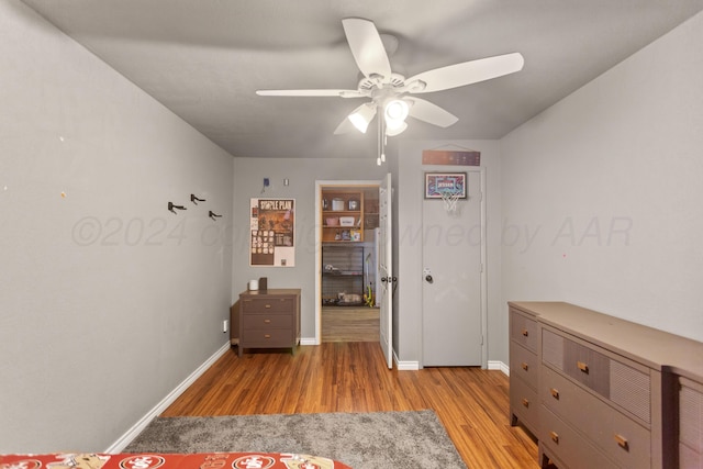 unfurnished bedroom featuring ceiling fan and light hardwood / wood-style floors