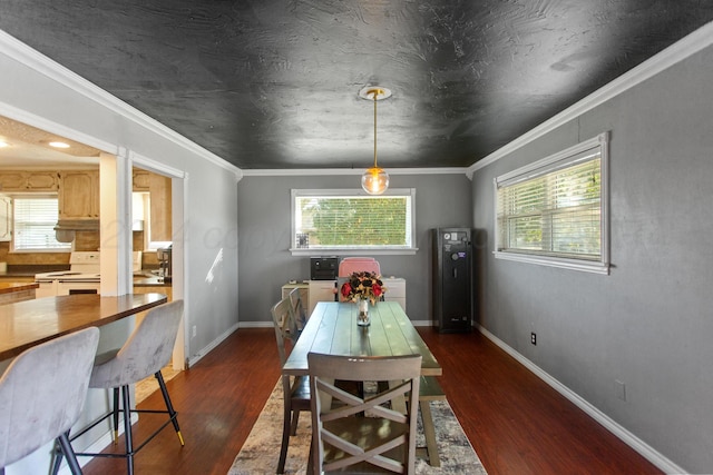 dining space featuring ornamental molding and dark hardwood / wood-style floors