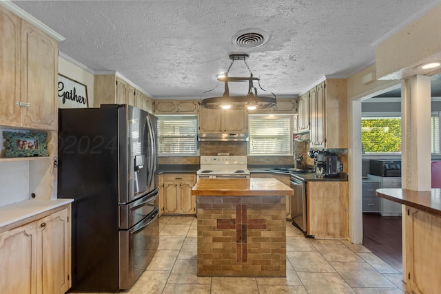 kitchen with a center island, tasteful backsplash, ornamental molding, pendant lighting, and appliances with stainless steel finishes