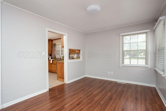 4417 Andrews Ave, Amarillo, TX 79106 - empty room featuring wood finished floors and crown molding