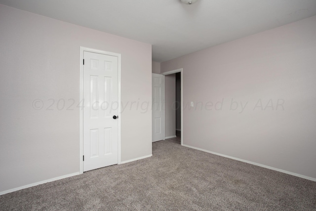 unfurnished bedroom featuring carpet flooring