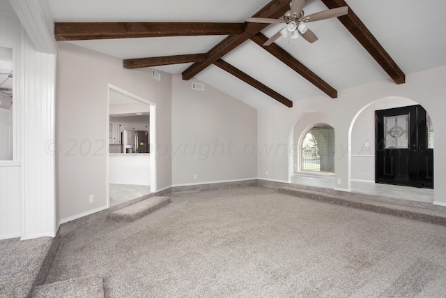 unfurnished living room with lofted ceiling with beams and ceiling fan