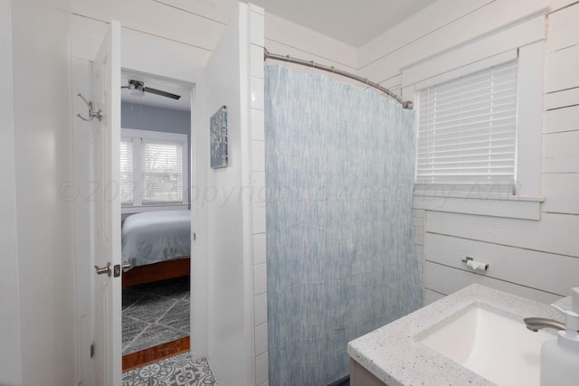 bathroom with walk in shower and vanity