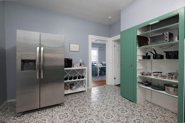 kitchen featuring stainless steel fridge with ice dispenser