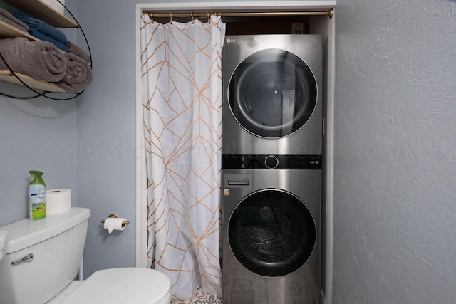 laundry area featuring stacked washer and dryer