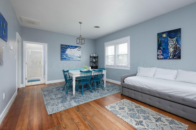 dining space featuring hardwood / wood-style flooring