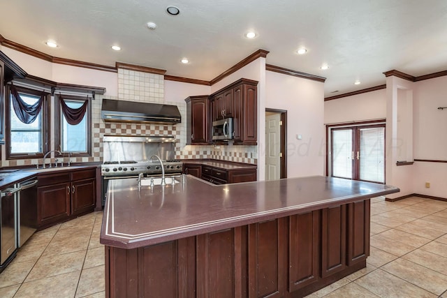 212 S Timbercreek Dr, Amarillo, TX 79118 - kitchen featuring dark countertops, stainless steel appliances, decorative backsplash, light tile patterned flooring, and a sink