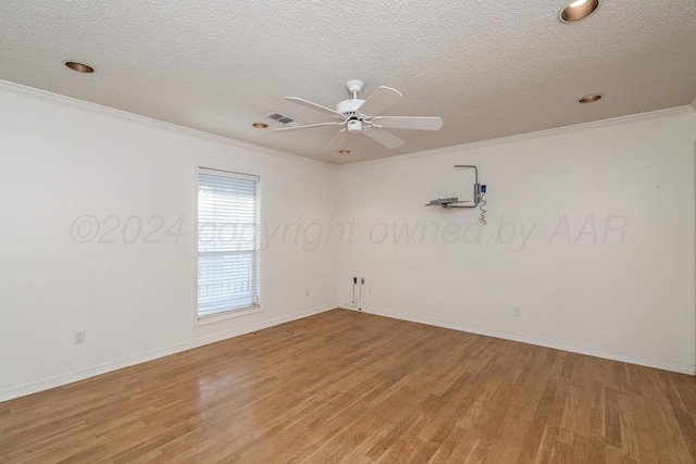 212 S Timbercreek Dr, Amarillo, TX 79118 - spare room featuring light wood-style flooring, crown molding, a textured ceiling, a ceiling fan, and baseboards