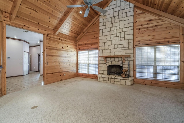 212 S Timbercreek Dr, Amarillo, TX 79118 - unfurnished living room with ceiling fan, carpet floors, a stone fireplace, wood ceiling, and wood walls