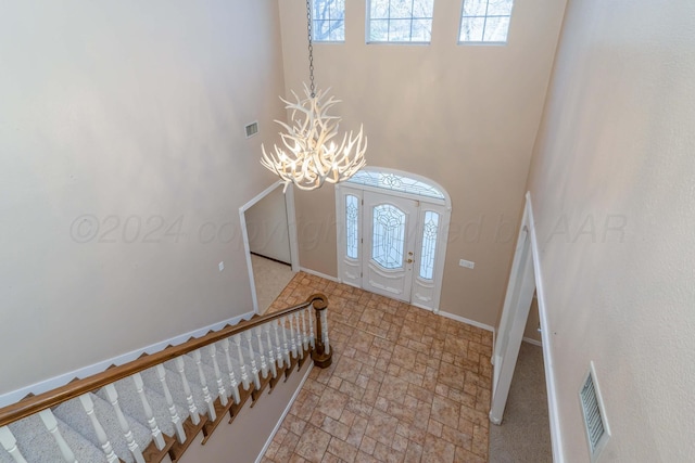 212 S Timbercreek Dr, Amarillo, TX 79118 - entryway with a chandelier, baseboards, and a towering ceiling