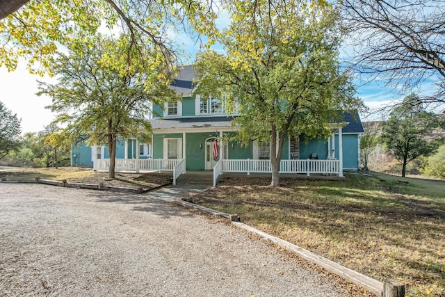 212 S Timbercreek Dr, Amarillo, TX 79118 - view of property hidden behind natural elements featuring covered porch and a shingled roof