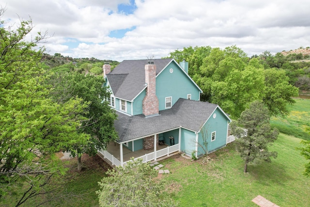 212 S Timbercreek Dr, Amarillo, TX 79118 - view of front of home with covered porch and a chimney