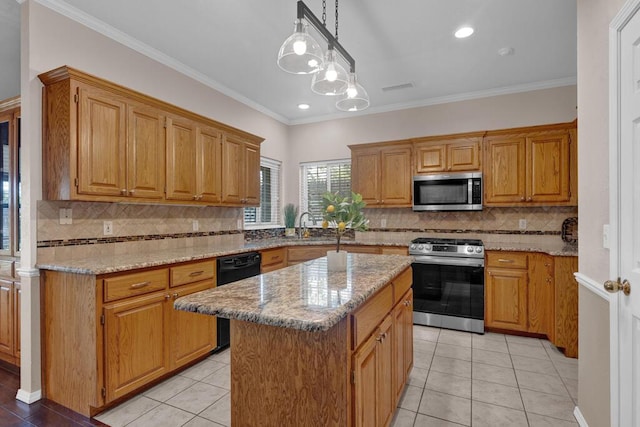 6611 Admiral Ct, Amarillo, TX 79124 - kitchen featuring stainless steel appliances, a center island, backsplash, light stone counters, and crown molding
