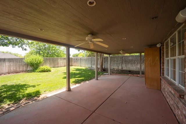 6611 Admiral Ct, Amarillo, TX 79124 - fenced backyard with ceiling fan and a patio