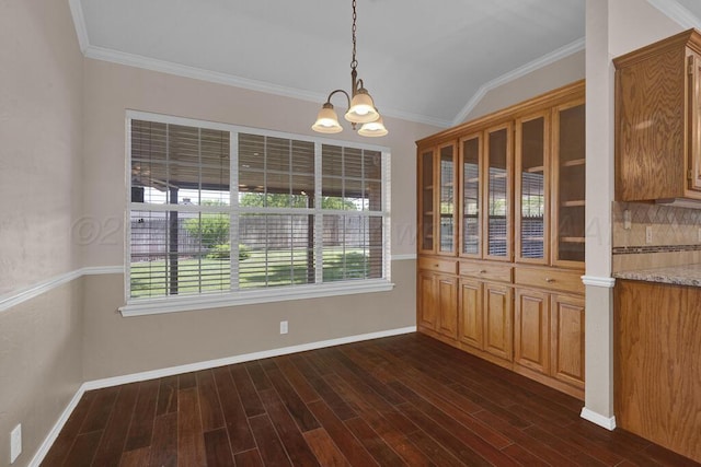 6611 Admiral Ct, Amarillo, TX 79124 - unfurnished dining area with a chandelier, plenty of natural light, dark wood-type flooring, lofted ceiling, and ornamental molding