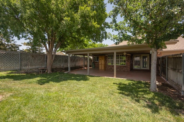 6611 Admiral Ct, Amarillo, TX 79124 - fenced backyard with a patio and ceiling fan