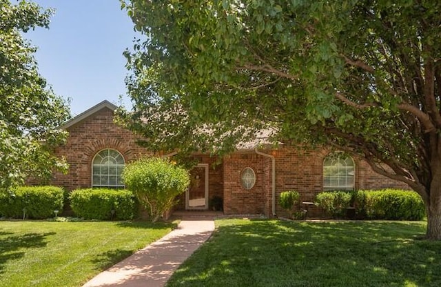 6611 Admiral Ct, Amarillo, TX 79124 - obstructed view of property with brick siding and a front yard