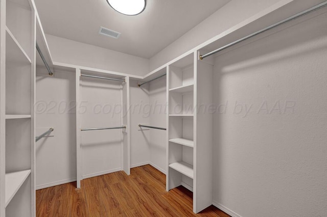 6611 Admiral Ct, Amarillo, TX 79124 - spacious closet featuring wood finished floors